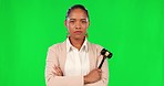 Serious, face and female judge with a gavel in a studio with green screen ready for court case. Crossed arms, confidence and portrait of woman lawyer with a hammer isolated by a chroma key background