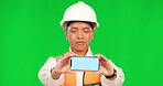 Green screen, phone and portrait of construction worker, engineer or industrial mockup on studio background. Chroma key, technology and mobile app for information, architect or industry marketing 