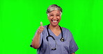 Thumbs up, doctor woman and green screen for healthcare success, yes and like or hospital support and thank you. Happy face, medical indian person or senior nurse with ok hand on a studio background