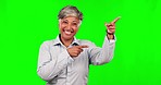 Green screen, senior woman face and pointing at business news information, discount promotion or brand logo. Chroma key portrait, advertising gesture or professional person smile on studio background