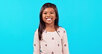 Smile, emoji and face of girl in studio with happiness, excited  and young children on blue background mockup. Portrait, happy and positive expression for chroma key announcement, promotion or sale