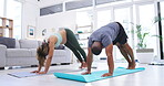 Couple, yoga and pregnant woman stretching, exercise and workout together in home, living room or apartment. Healthy, pregnancy and people stretch for body, fitness and training in house for wellness