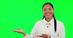 Happy woman, hands and advertising on green screen for presentation against a studio background. Portrait of female person with palm showing product or advertisement for marketing on mockup space