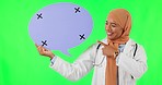Muslim woman, doctor and pointing to speech bubble on green screen against a studio background. Portrait of female medical or healthcare professional point for social media, chat or message on mockup