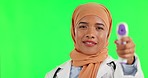 Thermometer, mockup and a Muslim doctor on a green screen for healthcare and medical check. Nursing, care and portrait of an Islamic nurse with a tool for a fever isolated on a studio background