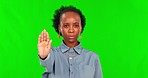 Green screen, woman face and stop, no and head shake for threat or warning on mockup background. Hand, protest and portrait of African lady person with emoji for reject, refuse or forbidden in studio