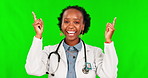 Happy, pointing and face of female doctor on green screen for deal announcement or advertising. Medical, medicine and healthcare with portrait of black woman on studio background for decision mockup