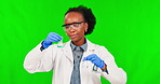 Green screen, science and black woman with chemistry, liquid and research with glass beaker on studio background. Happy, scientist or student or expert in experiment, test and safety in laboratory