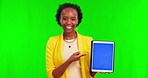 Woman, pointing and tablet by green screen, face and smile for review, app and mockup space for branding. African girl, digital touchscreen and blank for promotion, logo and happy in studio portrait