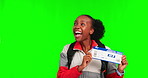 Black woman, travel and excited on green screen with ticket for plane, backpacking and happy dance on studio background. Mockup space, boarding pass with adventure and female traveller wave goodbye