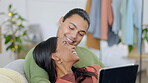 Love, couple with tablet and on sofa happy together in living room of their home together. Support or care, connectivity or social media and young married people kiss for bonding or quality time