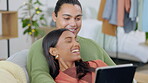 Support, couple with tablet and on sofa laughing together in living room of their home together. Love or care, connectivity or social media and young married people streaming with smile for happiness