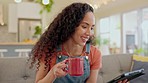 Happy woman, tablet and coffee on sofa in living room for streaming online movie, ebook subscription or reading blog. Young female person, drinking tea and digital technology for social media at home