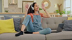 Headphones, dance and woman on sofa, listening to audio, singing and mental health, e learning break and happy home. Relax, dancing and african person or student music or radio streaming on computer