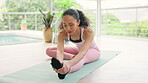 Pilates, stretching and woman in gym studio for fitness, exercise and workout, muscle health and legs or foot wellness. Flexibility, yoga and sports person on floor for holistic training and healing