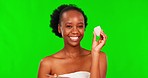 Green screen face, makeup brush or black woman with cotton for cosmetic treatment, remove foundation or skin routine. Chroma key portrait, skincare product choice or person smile on studio background