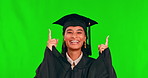 Face, graduate and woman pointing up on green screen in studio isolated on a background. Mockup space, graduation presentation and happy student in portrait for marketing, university and funny promo.