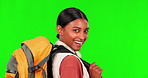 Hiking, smile and turn with a woman on a green screen background in studio to explore for adventure. Portrait, happy and backpack with a young female hiker looking excited on a trip against chromakey