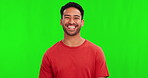 Happy, portrait of a man and smile against a green screen for positive. Happiness or cheerful, mockup space or confidence and young male person smiling against a chroma key for carefree or proud