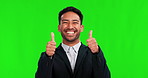 Thumbs up, smile and portrait of man on green screen for yes, support or thank you. Professional asian person on studio background for like emoji hand sign for good review or feedback and motivation