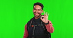 Asian man, hiker and okay hand sign on green screen for travel success against a studio background. Portrait of happy male person or traveler with OK gesture, approval or perfect adventure on mockup