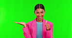 Presentation, product or thumbs up with a woman on green screen background in studio for advertising. Portrait, yes and palm of a happy young female brand ambassador on chromakey to like information