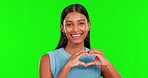 Green screen, face and happy indian woman with heart hands of love, care or kindness. Portrait, female model or smile for finger shape, emoji and thank you in studio, peace or trust on valentines day