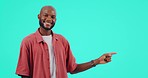 Black man, pointing with presentation and advertising information, opportunity and promo offer on blue background. Smile in portrait, male person and brand marketing, mockup space and news in studio