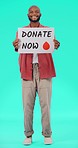 Donate blood, face and paper poster with young black man, smile and recruitment for healthcare emergency. African guy, student and billboard for promotion, volunteering and announcement in portrait