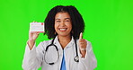 Thumbs up, green screen or happy woman doctor with business card for advertising healthcare. Portrait, face or nurse with approval hand gesture for okay, like or yes sign in studio for good promotion