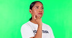Thinking, planning and a volunteering woman on a green screen for charity ideas and service. Serious, question and a female volunteer with a vision for activism isolated on a studio background