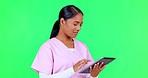 Nurse, woman and tablet on green screen in telehealth, healthcare service and hospital research or solution.  Thinking, ideas and medical worker, doctor or person on digital tech on studio background
