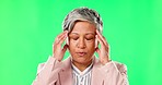 Senior, business woman and headache, green screen and massage temple with brain pain on studio background. Female professional, corporate burnout and migraine, health problem and mockup space