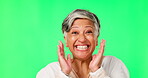 Face, wow and surprise with a woman on a green screen background in studio cheering an achievement. Portrait, motivation or celebration with a happy senior woman cheering on chromakey mockup