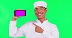 Chef, phone and woman pointing on green screen in restaurant promotion, online menu and presentation. Mobile app, mockup and food expert, cook or person with tracking markers and studio background