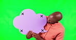 Speech bubble, pointing and a black man on green screen in studio for social media marketing. Portrait, communication or advertising and a male brand ambassador holding mockup with tracking markers