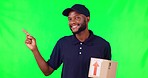 Black man, box and pointing on green screen in list, presentation or info against a studio background. Portrait of happy African male person, delivery or courier guy show step or menu on mockup space