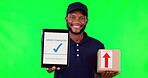 Tablet, box and complete with a black man on a green screen background in studio for distribution. Technology, supply chain logistics and delivery with a young male courier on chromakey mockup