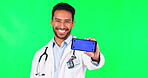 Asian man, doctor and phone mockup on green screen for social media advertising against a studio background. Portrait of male person, medical or healthcare smartphone app display and tracking markers