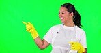 Happy asian woman, housekeeper and pointing on green screen with detergent for clean hygiene. Portrait of female person, maid or cleaner for advertising with spray bottle against a studio background