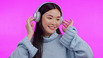 Music, dance and headphones with an asian woman in studio isolated on a pink background for streaming audio. Smile, freedom and energy with a happy young female person listening to a radio playlist