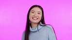 Happy, woman face and dance in studio for good news, celebration or positive attitude on purple background. Portrait, smile and asian female person dancing, confident and fun, vibes and excited 