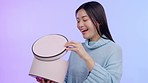 Asian woman, studio and open gift box with smile, surprise and winner with prize, birthday and happy by background. Japanese girl, student and package with wow for giveaway, present and competition