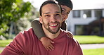 Happy, excited and a boy hugging his father in the backyard of their home while spending time together in summer. Portrait, smile and love with a young son running to embrace his dad in the garden