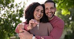 Keys, new house or happy couple hug outdoor with face for property, real estate goals or residential investment. Portrait, man and woman in garden for moving, key to relocation and building mortgage