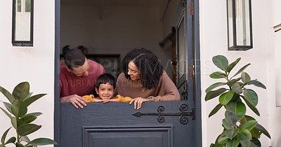 Mom, dad and child at door of home enjoying new house for bonding ...