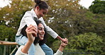 Mother, daughter and piggyback walking in park or garden for fun bonding, holiday or weekend outside. Happy mom carrying her child on shoulders for family time together in nature or forest by house