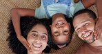 Happy family, relax and hands on face on a floor with love, bond and enjoying weekend at home together. Top view, portrait and girl child with young parents in a living room smile, fun and resting 