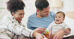 Family, couple and quality time with baby, mom and dad playing with toys for fun, laughing together in home, bedroom or nursery. Newborn, infant and happiness in motherhood, family or child smile