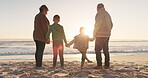 Family holding hands, grandparents and grandkids on the beach, sunrise and nature with back view and ocean. Love, care and support, vacation and solidarity, old woman and man with children outdoor